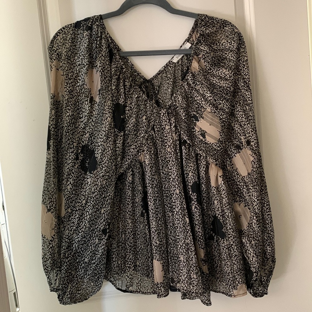 Beautiful bucket list top. It has never been worn. I took the tags off.